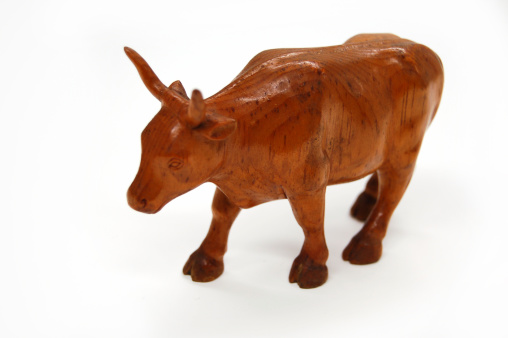 A hand carved steer on a white background.YOU MIGHT ALSO LIKE THESE INTERESTING OBJECTS