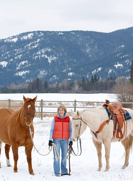 istock Blond woman with two horses. 172389113
