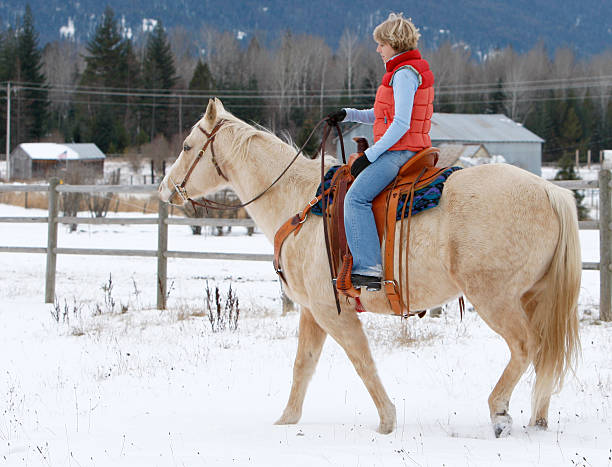 istock Blond Girl Riding Horse 172389130