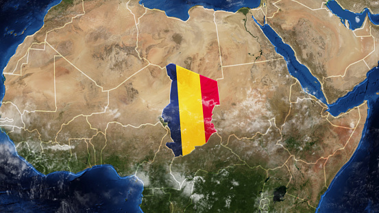 Credit: https://www.nasa.gov/topics/earth/images\n\nAn illustrative stock image showcasing the distinctive tricolor flag of Chad beautifully draped across a detailed map of the country, symbolizing the rich history and culture