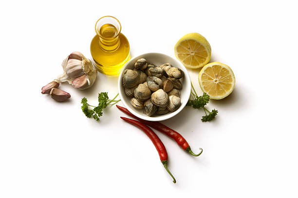 Vongole Seafood Clams with tomatoes and parsley in frying cooking pan on concrete background