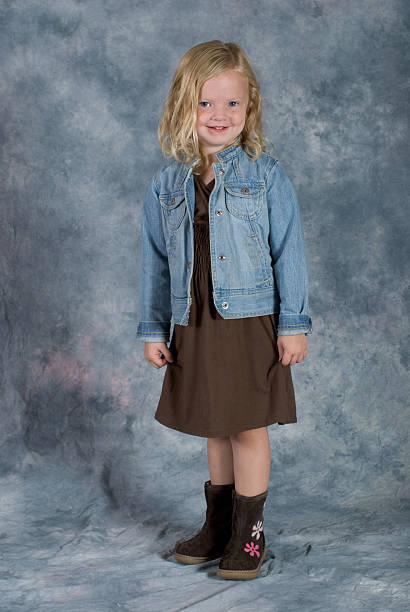 Classic School Pose. "Shown here is a super cute preschool age girl posing for her school picture.  The model has: blue eyes, blond hair, freckles, a cute outfit and a great smile.See other related images here:" school picture stock pictures, royalty-free photos & images