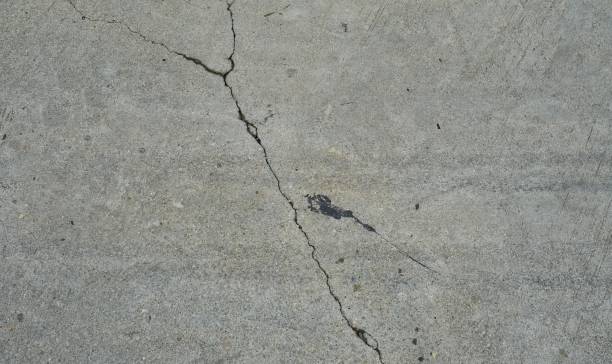 istock a crack in the concrete.. 1723900728