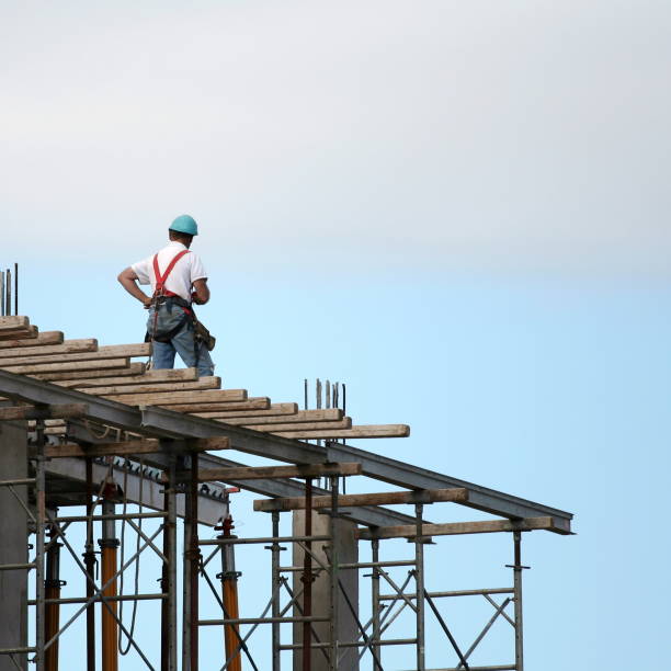 istock Construction worker standing on top of worksite 172390098