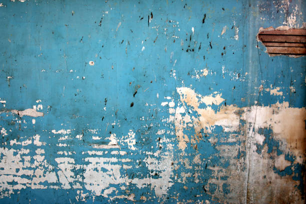 Dirty blue spattered wall background "Peeling blue paint, yellowed plaster and old slats with a touch of mold. I've more" painted drywall texture stock pictures, royalty-free photos & images