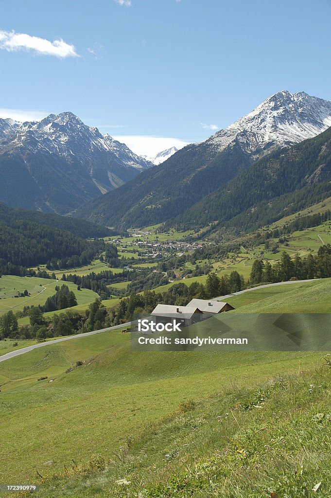 Small Houses in Engadine Valley Valley of Lower Engadine with view from Guarda in direction of Zernez. Two small houses in the foreground. Graubunden Canton Stock Photo