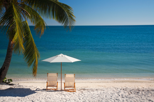 chairs and umbrella on a nice beach in the Florida Keys
