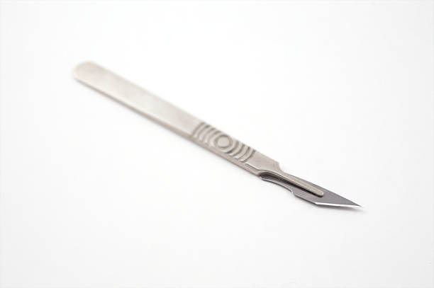 Surgical scalpel (focus on blade) stock photo