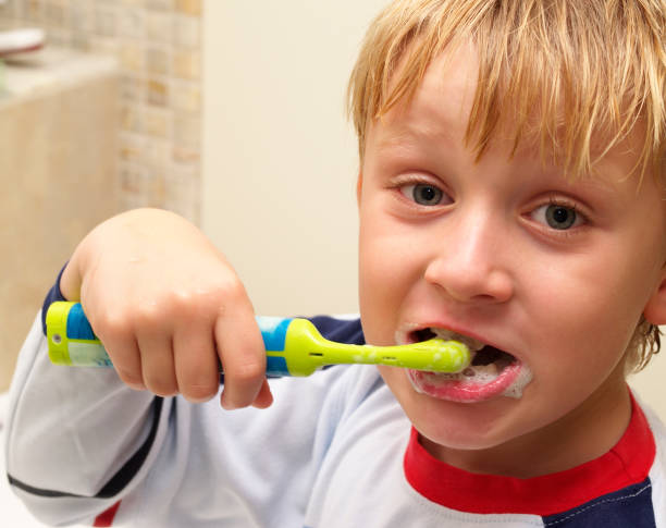 istock dental care child brushing teeth 172391259
