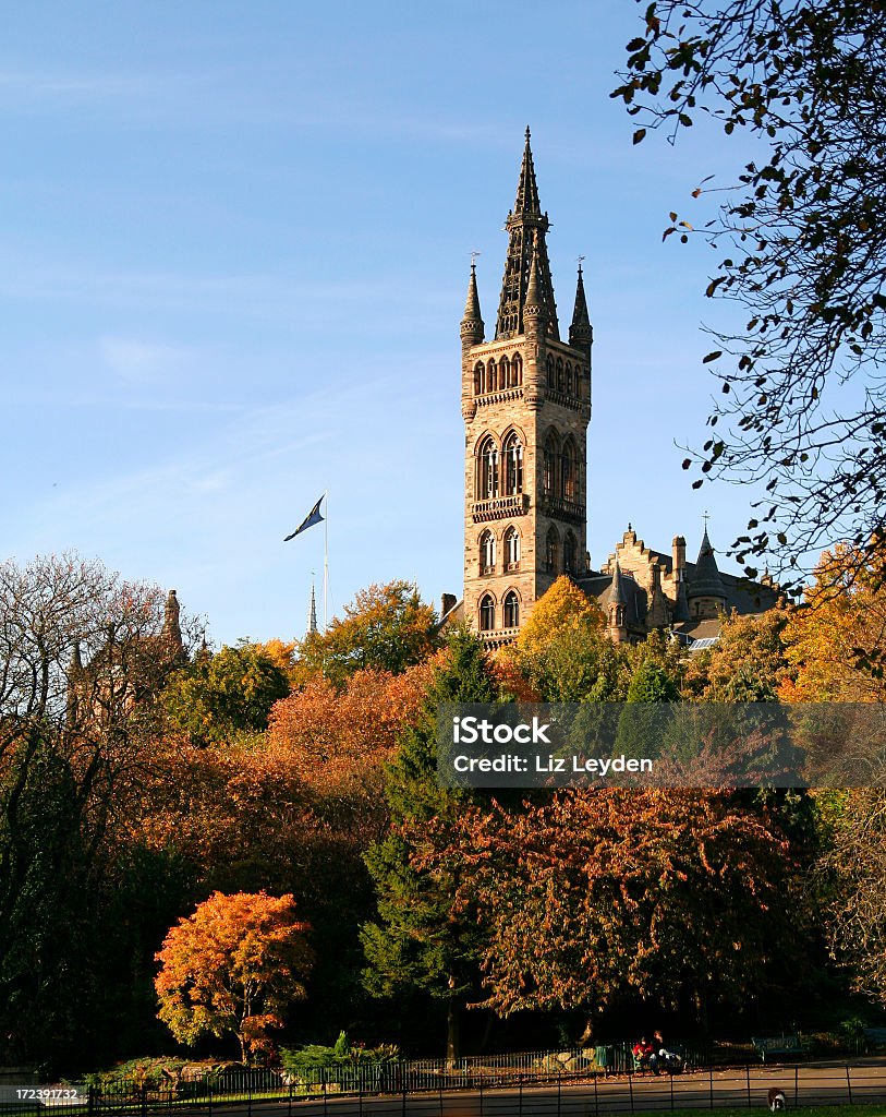 Tower at Glasgow University in autumn The iconic main building of Glasgow University in Autumn. This building, completed in 1886, was designed by Sir George Gilbert Scott, and is now called the Gilbert Scott Building. Architecture Stock Photo