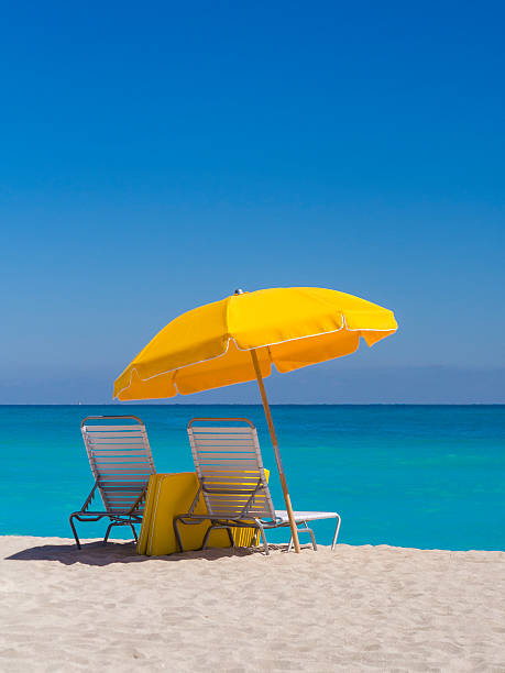 istock Yellow Umbrella and deck chairs South Beach Miami 172391951