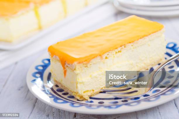 Orange Tompouce Traditional Dutch Pastry On A Rustic Table Stock Photo - Download Image Now