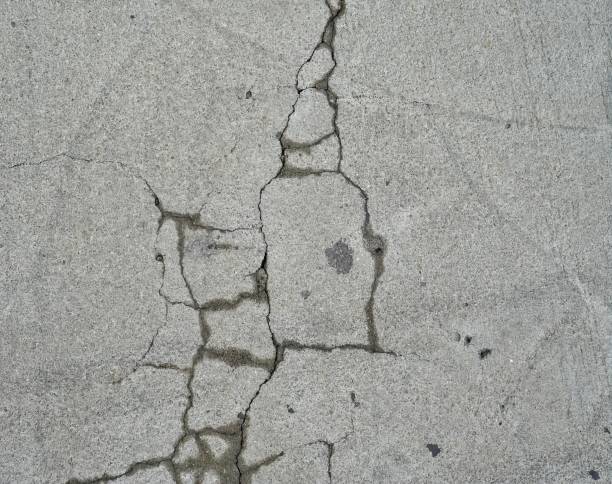 istock crack in the sidewalk, close up.. 1723926803