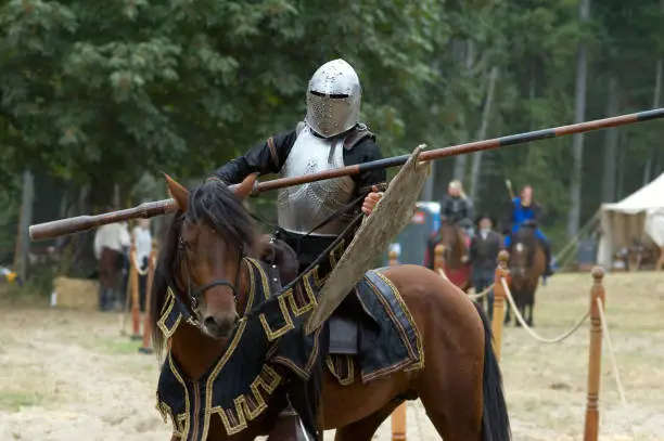 Medieval knight on horseback at a jousting tournament.