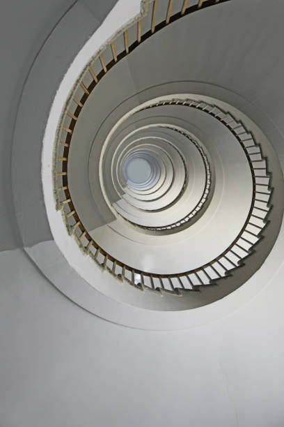 istock spiral staircase going up vertically without people 1723937321