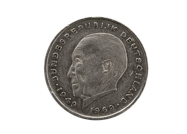 Close-up of a German two Mark coin, isolated on white. The coin is used and shows scratches on the surface. It shows a profile of Konrad Adenauer and was issued from 1969 untill 1987.