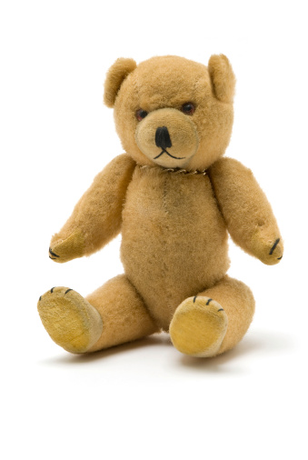 A brown teddy bear on a white background