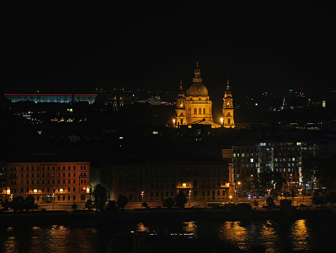Night view of St Stephens Church in Budapest capital of Hungary and the reflections on the Danube River