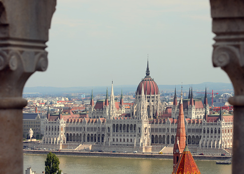 Hungarian parliament in Budapest on bank of Danube river between two columns