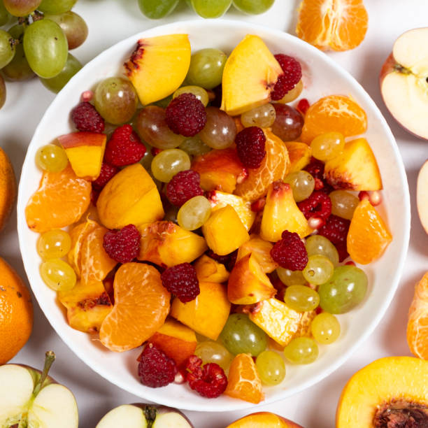 istock Fruit salad with sliced fruit, mixed grapes, raspberries, nectarines, tangerines and apples 1723943225