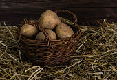 Potatoes in a basket on straw
