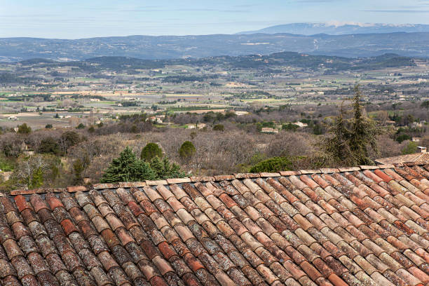 Old tiled roof and Luberon landscape