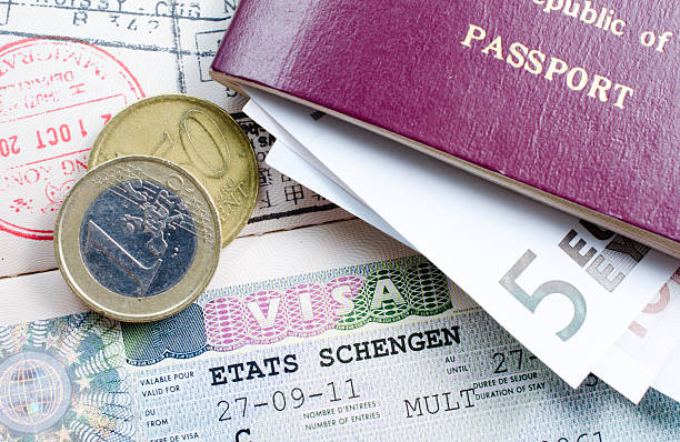 schengen visa schengen visa and EU coins schengen agreement stock pictures, royalty-free photos & images