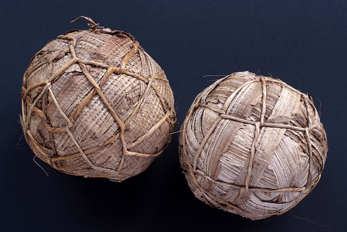 Two typical rwnadan football balls which are done only with banana tree leaves and fibers. Kids prepare them tehmself and then they can play football !