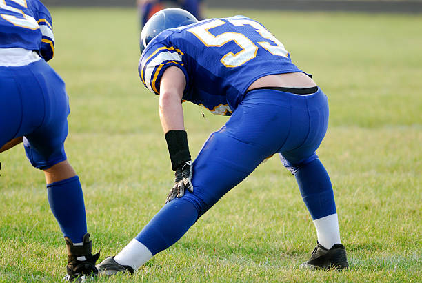 istock American football player stretching. 172395893