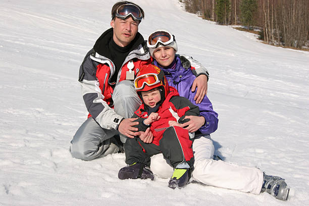 Happy family on winter resort stock photo