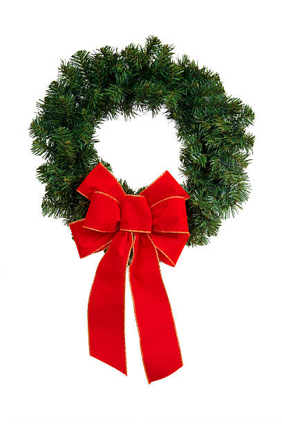 istock A green and red Christmas wreath against a white background 172395923