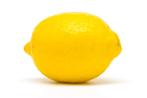 A perfectly fresh lemon isolated on white.Click on the banner below to see more photos like this.