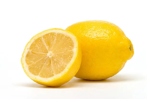 Two perfectly fresh lemons isolated on white.