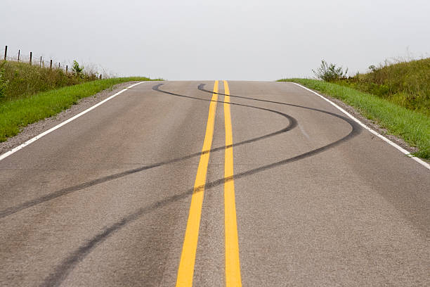 unavoidable skid marks left on blacktop road street skid marks stock pictures, royalty-free photos & images