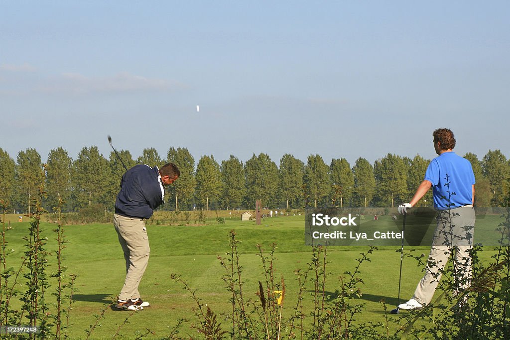 Les joueurs de Golf avec volant ballon - Photo de Parcours de golf libre de droits