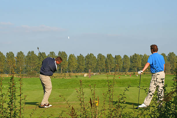 istock Golf players with flying ball 172397248