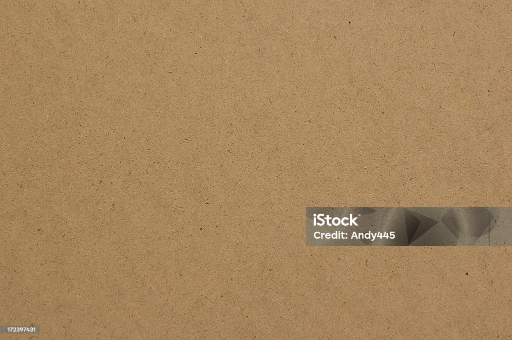Hardboard texture with tan colors high-density fiberboard texture up-close. Cardboard Stock Photo