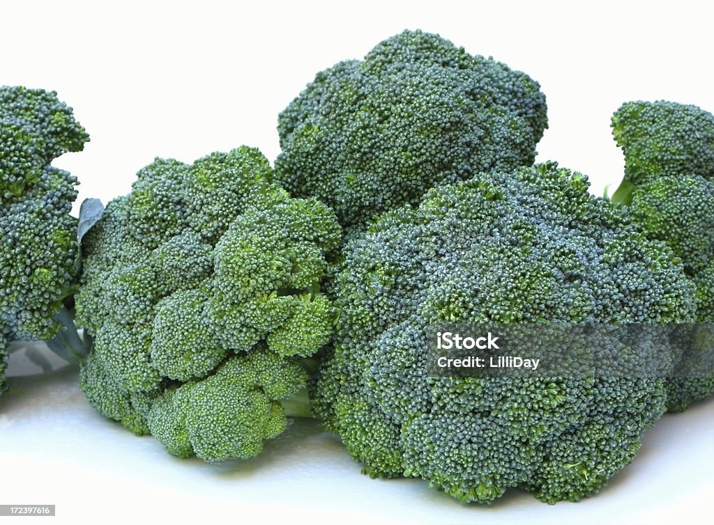 Fresh Broccoli Bunches Fresh broccoli bunches on white platter Abundance Stock Photo