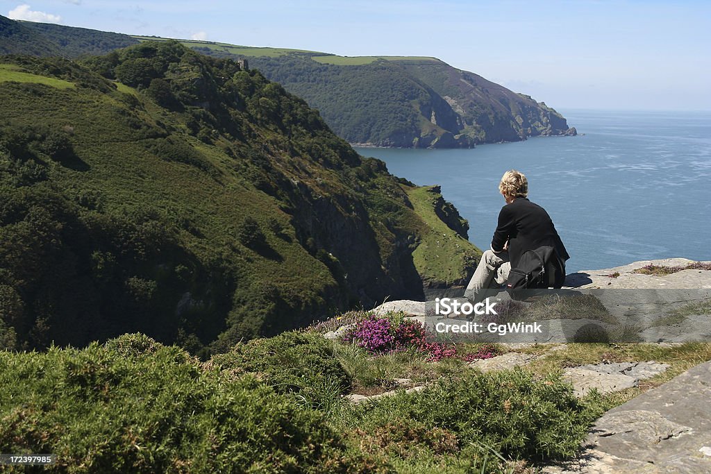 Enjoying "Women enjoying the beautiful view at the North Devon coastline. Taken at the Valley of Rocks, Devon, England." Exmoor National Park Stock Photo
