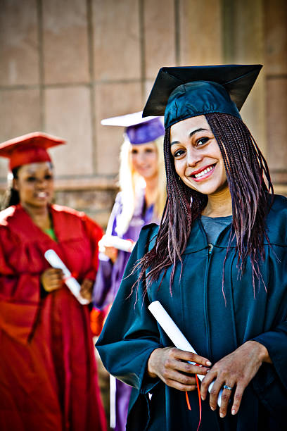 istock graduation girl with braids up front (girls in background) 172398840