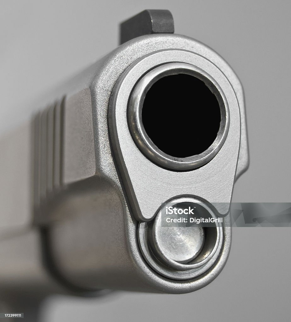 Horizontal 45 Caliber Stainless Steel Handgun The business end of a large-bore handgun.View more images from this collection below! Cut Out Stock Photo