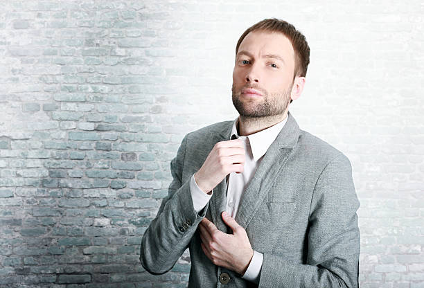 istock Fashionable businessman fixing his tie 172399194