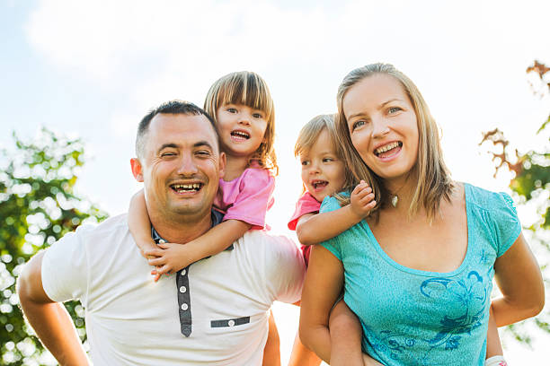 istock Parents piggybacking their children. 172399340
