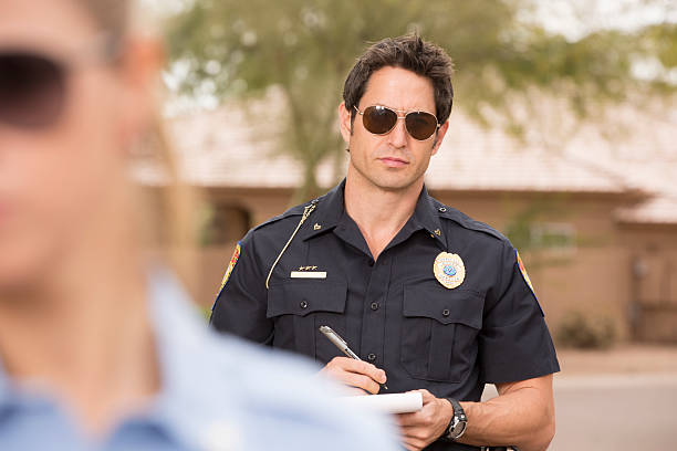istock Police Man with his partner on a traffic stop 172399544