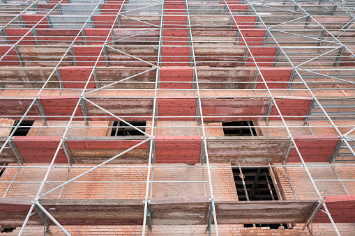 scaffolding at historic brick wall building currently under redevelopment