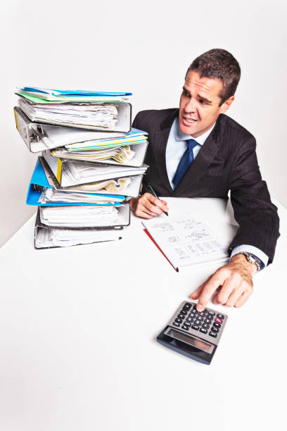 istock Nervous businessman tries to catch up with huge workload 172400036