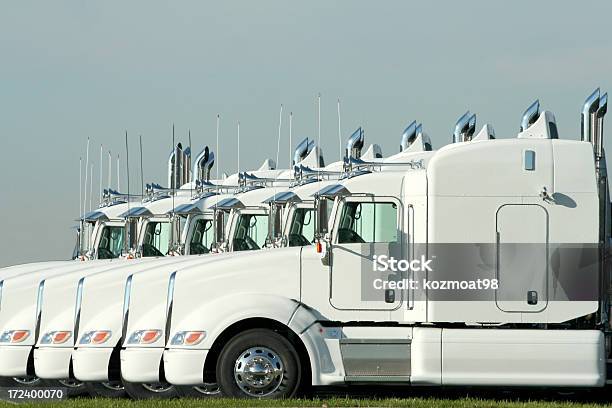 Six Identical White Semi Trucks Parked Together Stock Photo - Download Image Now - Fleet of Vehicles, Convoy, Semi-Truck