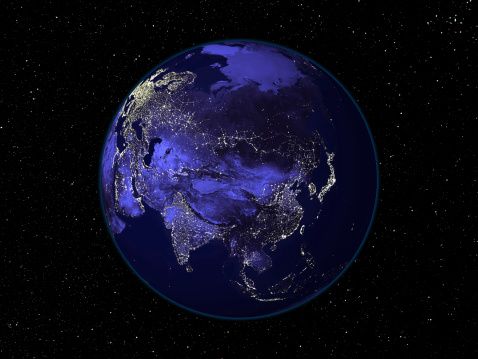 Beautiful nightime photograph of earth at night with Asia in the centre showing its city lights. Deep space starfield in the background. Photograph has been extensively enhanced. 