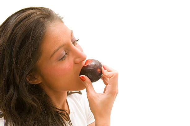слива - plum eating women fruit стоковые фото и изображения