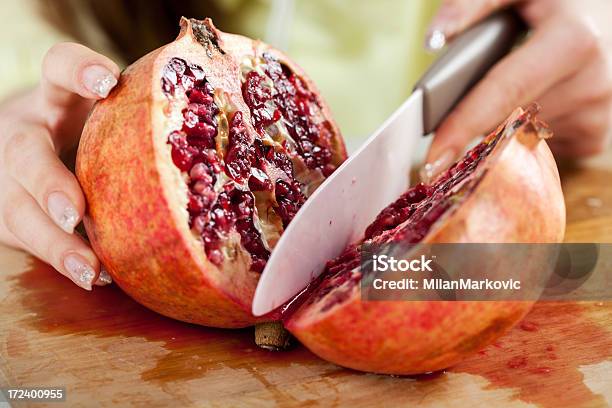 Slicing Pomegranate Stock Photo - Download Image Now - Close-up, Cross Section, Cutting